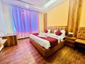 Postelja oz. postelje v sobi nastanitve Royal Residency Inn - Manali