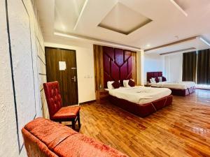 Postelja oz. postelje v sobi nastanitve Royal Residency Inn - Manali