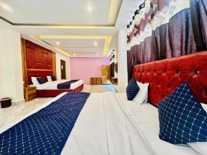 Postelja oz. postelje v sobi nastanitve Royal Residency Inn - Manali