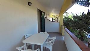 a white table and chairs on a balcony at Residence Sun Bay in Vieste