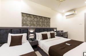 Krevet ili kreveti u jedinici u okviru objekta Hotel Artilla Mumbai