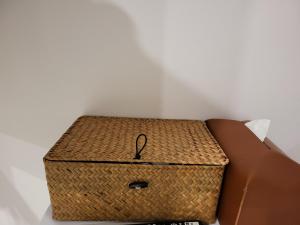 a wicker chest sitting next to a box at Hotel Dongnae in Busan