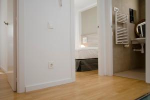 A bed or beds in a room at Casas Apartamentos Gracia