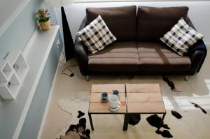 A seating area at Casas Apartamentos Gracia