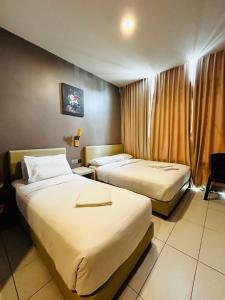 Postel nebo postele na pokoji v ubytování DS Hotel