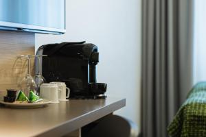 a coffee maker on a counter in a hotel room at Quality Hotel Winn Haninge in Haninge