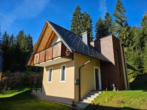 a house with a solar panel on the roof at Siedls Enzian in Hirschegg Rein
