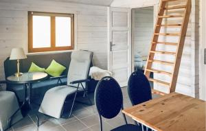 a room with a table and chairs and a ladder at Gorgeous Home In Rybical With Wifi in Rybical