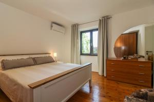 Postel nebo postele na pokoji v ubytování Roža in Sveti Bartol (Haus für 2-3 Personen)