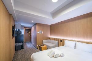 Postel nebo postele na pokoji v ubytování Apartment Hotel 11 Namba Minami 4 + 24 fotografií