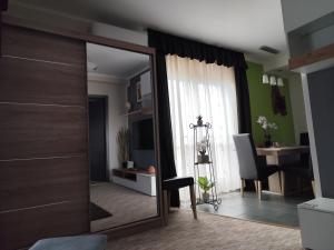 TV a/nebo společenská místnost v ubytování GT Apartman
