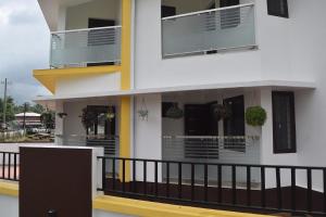 a balcony of a house with two balconies at 2BHK Flat At Chalakudy Town Konuparamban Residence A1 in Kizhake Chālakudi