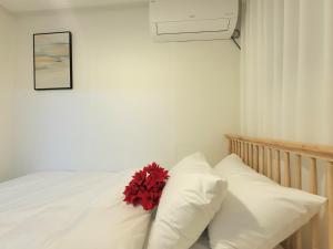 Postel nebo postele na pokoji v ubytování happy stay