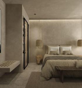 Łóżko lub łóżka w pokoju w obiekcie Τhe Noverian Antama Organic Beach Resort Chania