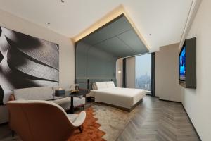 Televiisor ja/või meelelahutuskeskus majutusasutuses Atour S Hotel Wuhan Jiangchengtian Street Xinhua Road