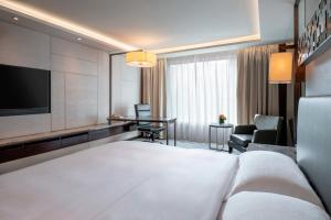 เตียงในห้องที่ InterContinental Grand Stanford Hong Kong by IHG