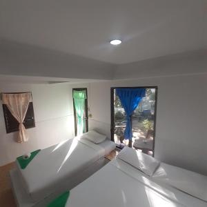 Postel nebo postele na pokoji v ubytování Phangan Hideaway Bungalows