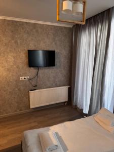 Ένα ή περισσότερα κρεβάτια σε δωμάτιο στο Cozy Bakuriani Apartment +2 φωτογραφίες