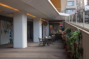 a restaurant with tables and chairs in a building at Classy Suite Taksim in Istanbul