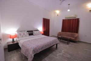 Voodi või voodid majutusasutuse Satyam Palace Resort toas