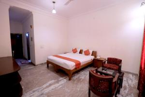 Voodi või voodid majutusasutuse Satyam Palace Resort toas