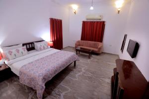 Voodi või voodid majutusasutuse Satyam Palace Resort toas