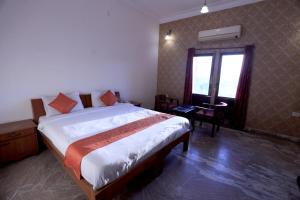 Voodi või voodid majutusasutuse Satyam Palace Resort toas