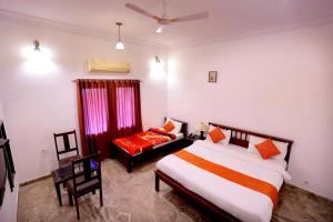Voodi või voodid majutusasutuse Satyam Palace Resort toas