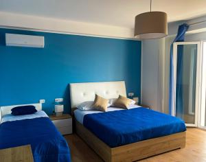 Postel nebo postele na pokoji v ubytování B&B e Apartment MARIA VITTORIA - Anzio Blue Horizon - 150 mt dal mare