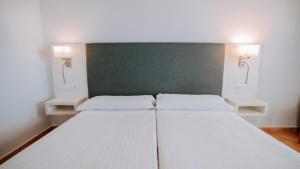 Postel nebo postele na pokoji v ubytování Hotel Bahia Sur