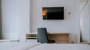 TV a/nebo společenská místnost v ubytování Hotel Bahia Sur