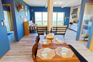 a dining room and living room with a table and chairs at パーティーができるビーチハウス海まで1分一棟貸切Qiao105屋外犬可 in Hokota +45 photos