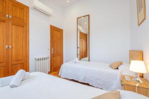 Ein Bett oder Betten in einem Zimmer der Unterkunft Can Rafelino