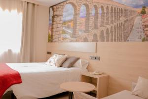 Postel nebo postele na pokoji v ubytování Hotel Venta Magullo