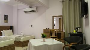 Postel nebo postele na pokoji v ubytování Good Season Hotel