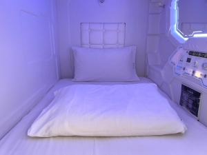 Postel nebo postele na pokoji v ubytování 沐品居 無櫃檯自助旅店