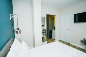 Postel nebo postele na pokoji v ubytování Domus Bat Galim Hotel