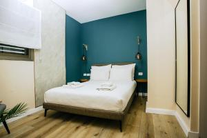 Postel nebo postele na pokoji v ubytování Domus Bat Galim Hotel