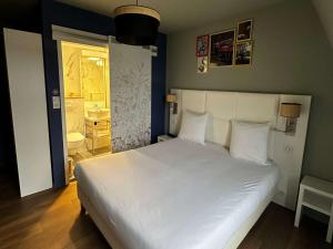Postel nebo postele na pokoji v ubytování greet hotel Lille Gare Flandres - Groupe Accor