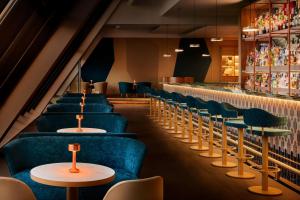 a row of tables and chairs in a restaurant at Tivoli Marina Vilamoura in Vilamoura