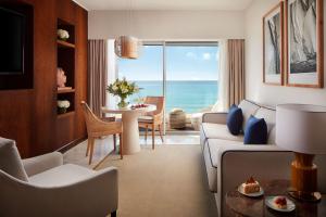 a living room with a view of the ocean at Tivoli Marina Vilamoura in Vilamoura