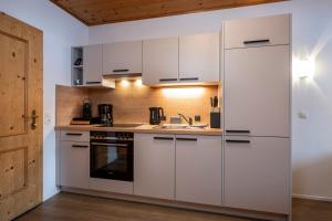 Kuchyň nebo kuchyňský kout v ubytování Aparthotel Stadler