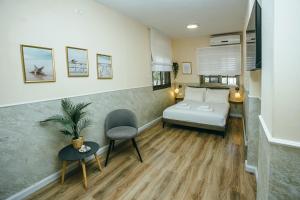 Postel nebo postele na pokoji v ubytování Domus Bat Galim Hotel