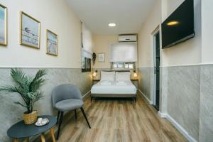 Postel nebo postele na pokoji v ubytování Domus Bat Galim Hotel