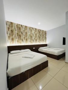Postel nebo postele na pokoji v ubytování DS Hotel