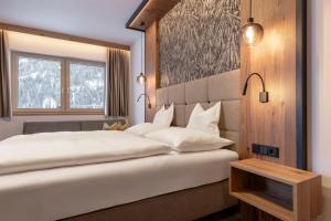 Posteľ alebo postele v izbe v ubytovaní Hotel Post Kappl