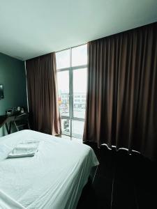 Postel nebo postele na pokoji v ubytování DS Hotel
