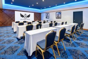 a conference room with rows of tables and chairs at The Saint Hotel, New Orleans, French Quarter, Autograph Collection in New Orleans