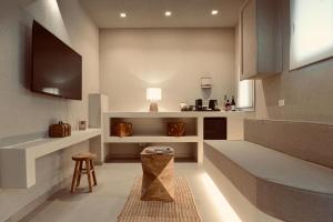 a kitchen with a table and a stool in a room at Palermo Inn Boutique Arte in Palermo