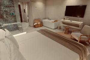 a bedroom with a bed and a tv in a room at Palermo Inn Boutique Arte in Palermo